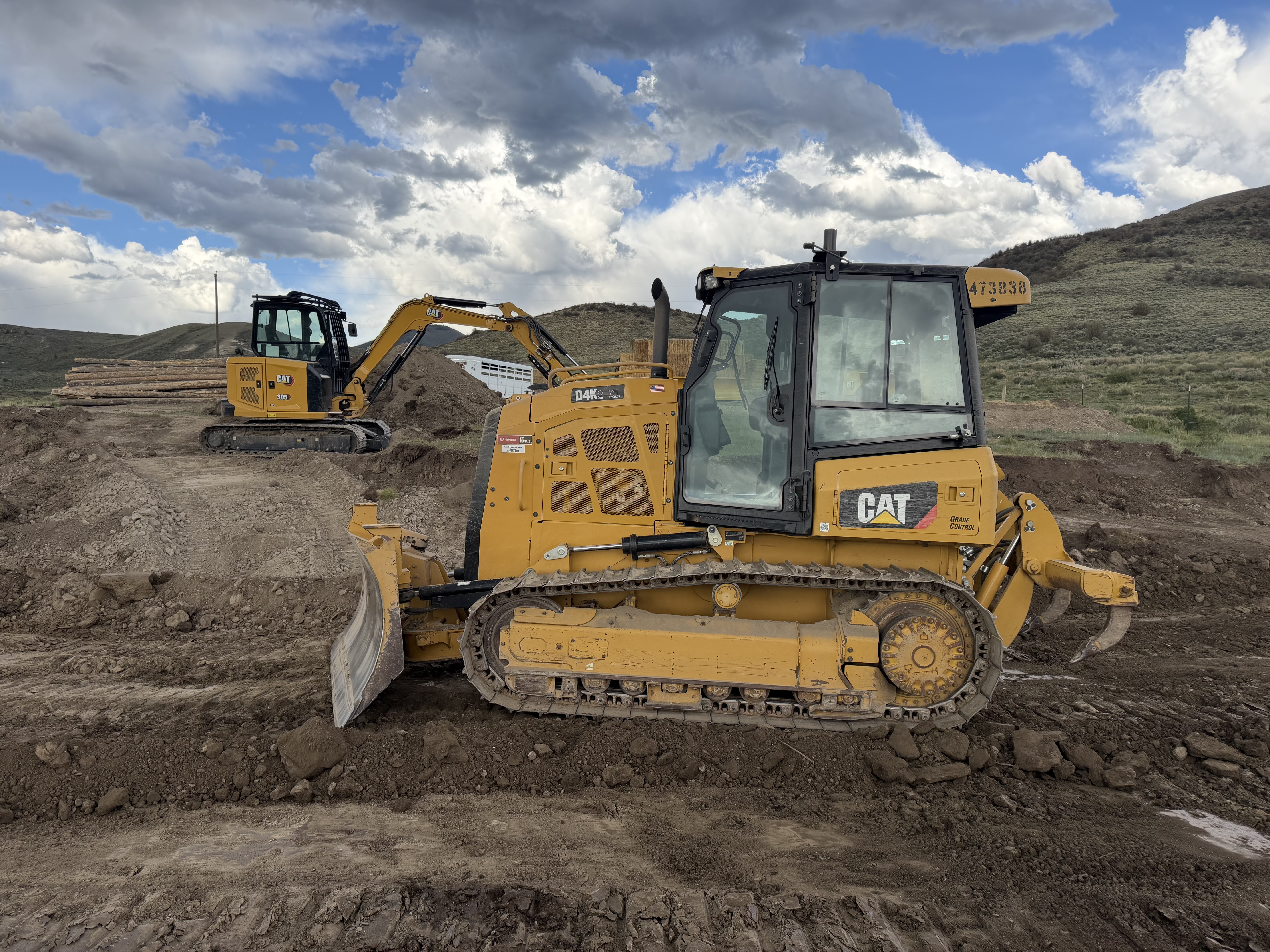 Bulldozer and skid steer equipment on a ranch property